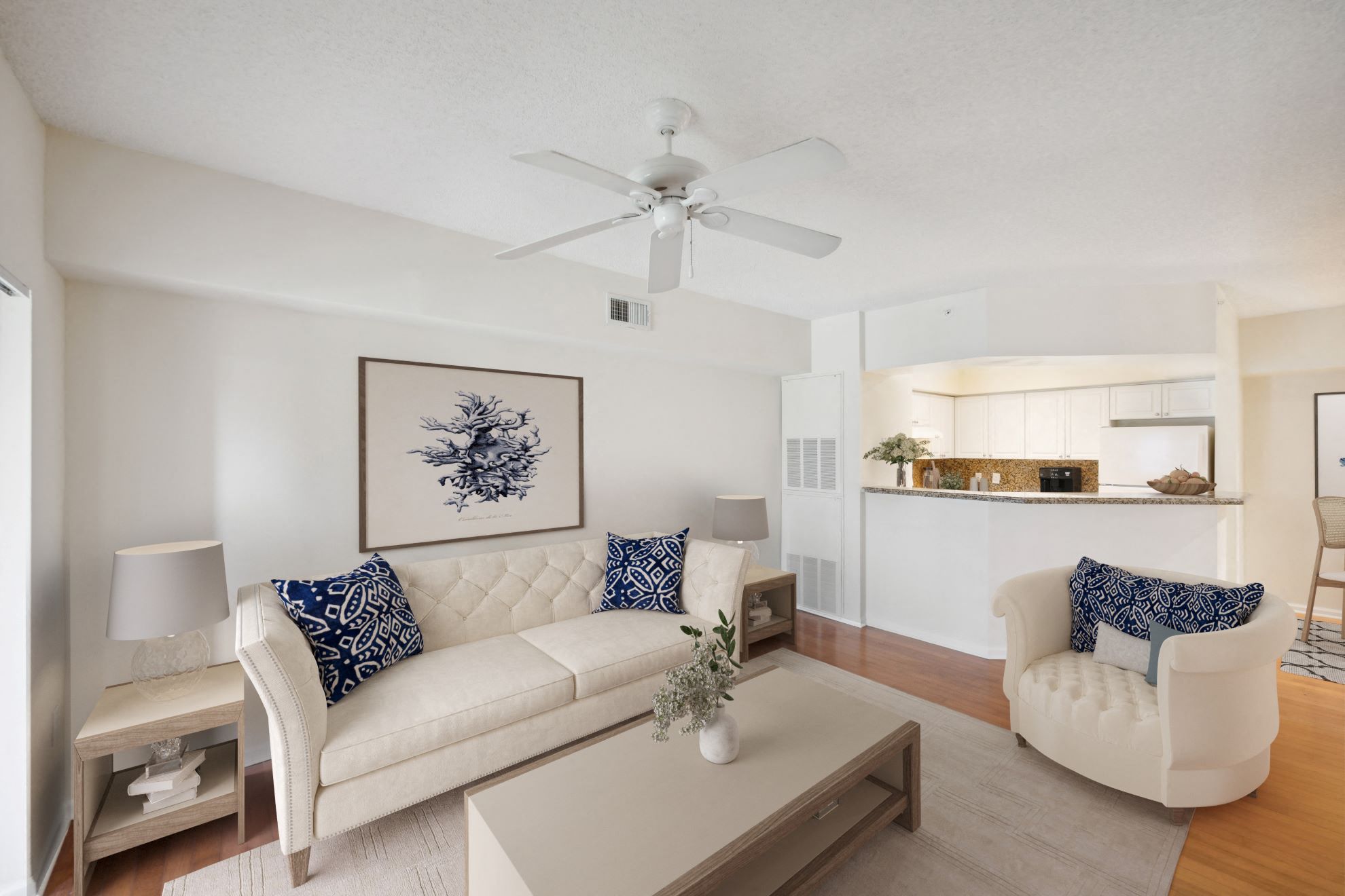 a living room with a white couch and a coffee table